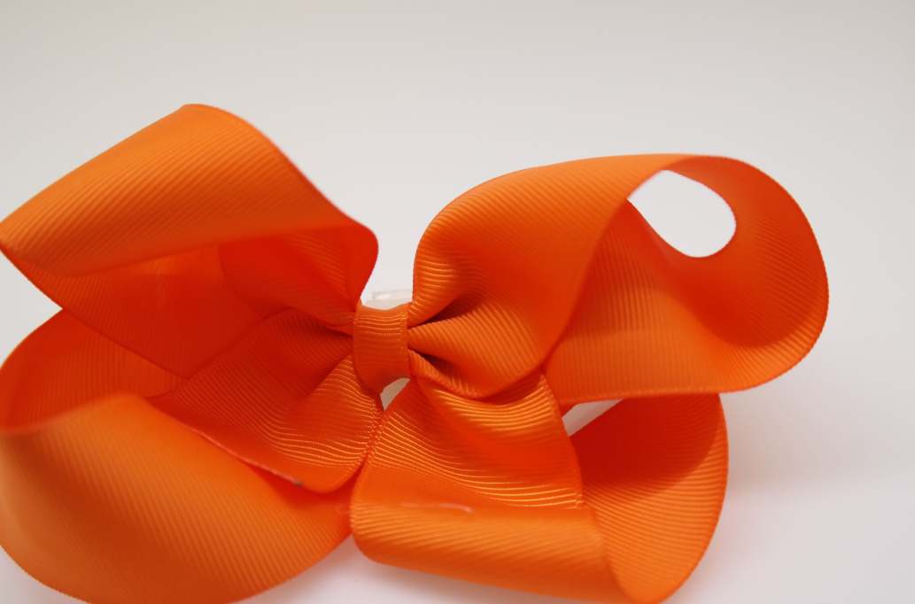 Itty bitty tuxedo hair bow Color: Russet Orange